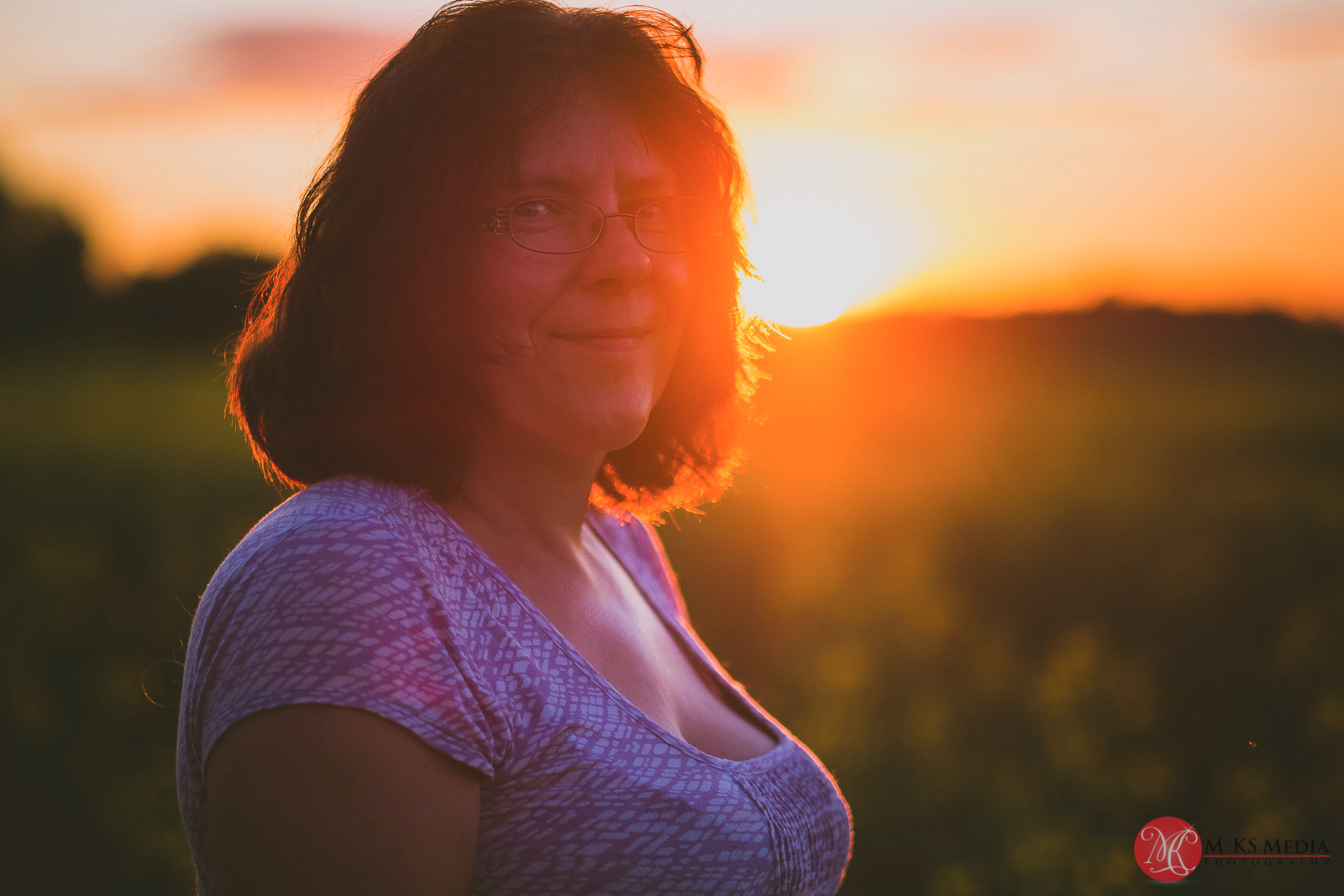 Alberta canola field sunset portrait of a woman